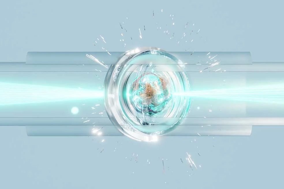 An illustration of electrons racing around within a tube as laser beams pass through.